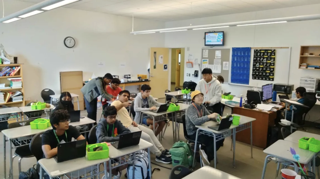 Adhikari aids club members to understand cybersecurity members. (Photo credits: Justin Kuo)